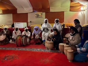 Traditional Berber nomads during a cultural experience in the Moroccan Sahara