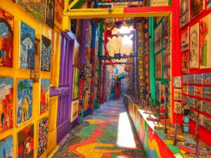 Colorful Moroccan souk alley with vibrant handmade carpets and traditional decorations