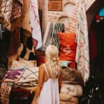 Traditional Moroccan medina alley with local artisan shops and handmade crafts