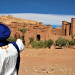 Visitors exploring Ait Ben Haddou Kasbah in Morocco